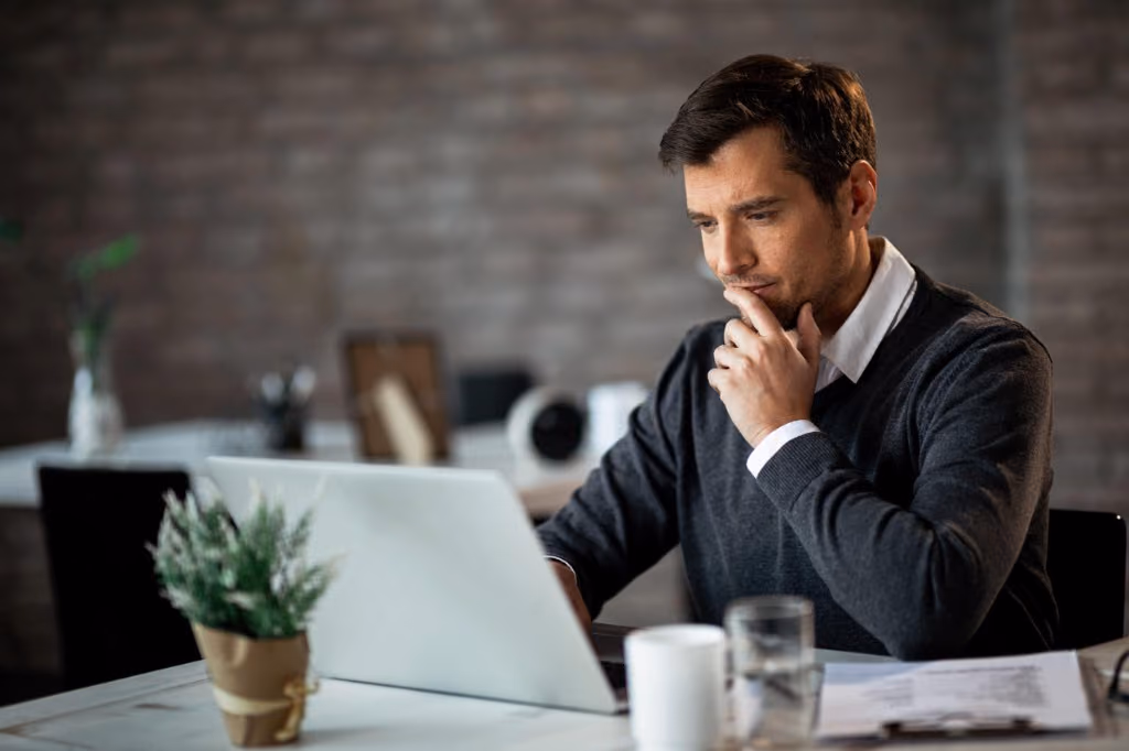 Business owner working at a laptop